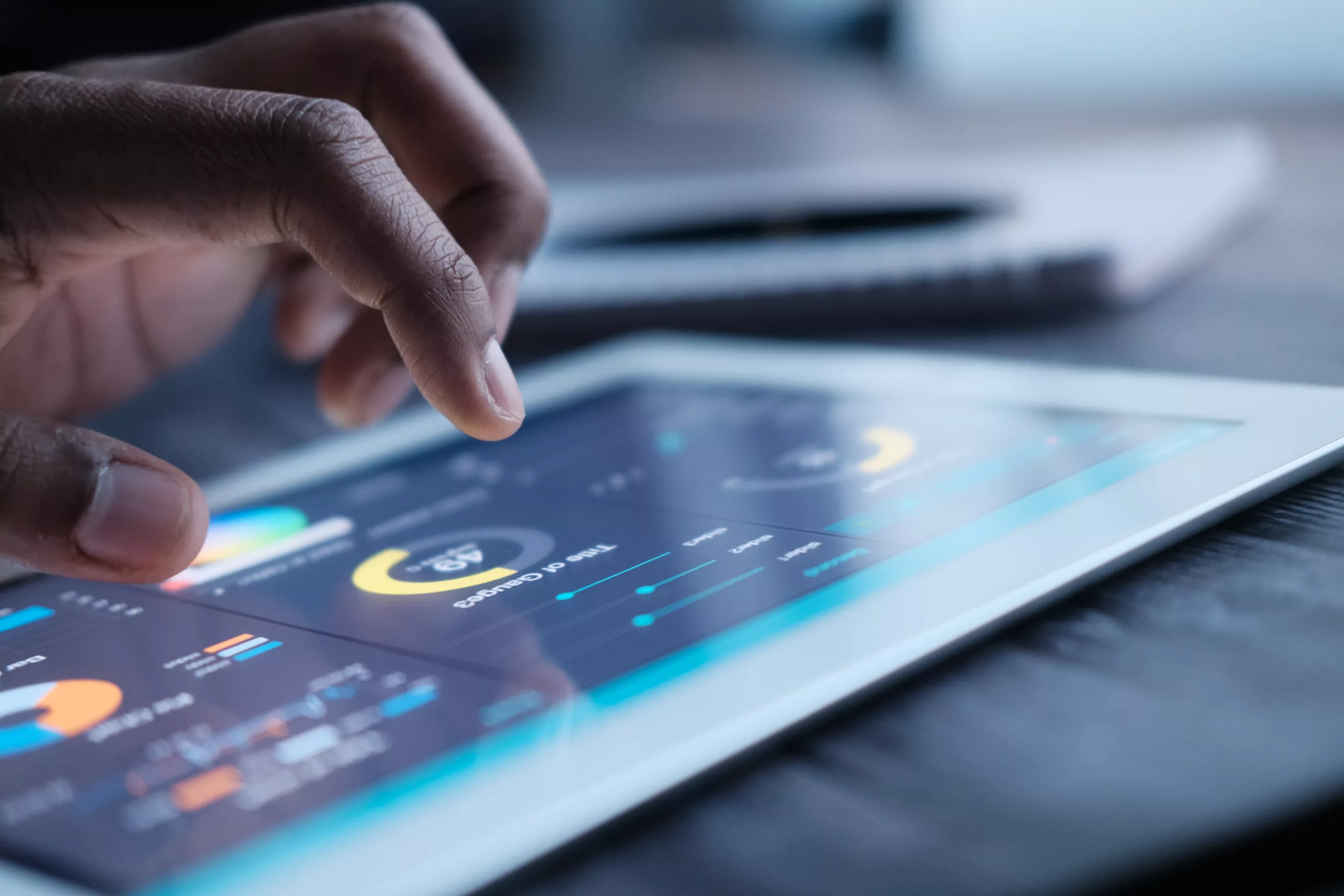 Close Up Of Investor Hand Analyzing Stock Market Charts On Digital Tablet