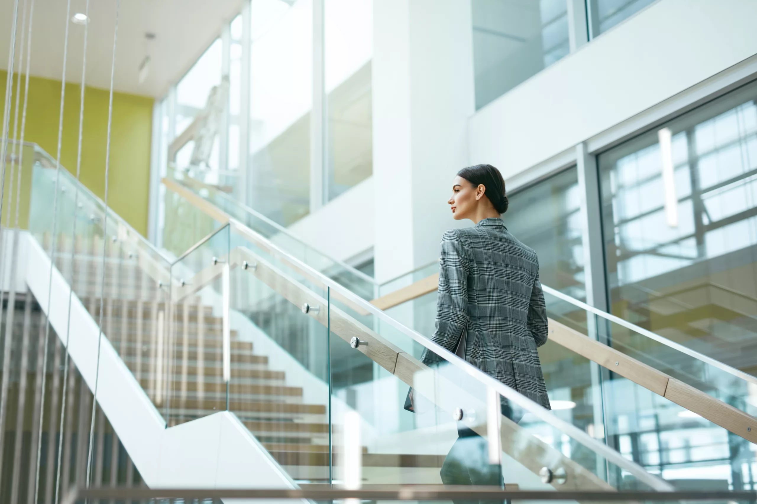 Female Worker On Stairs In Office Indoors