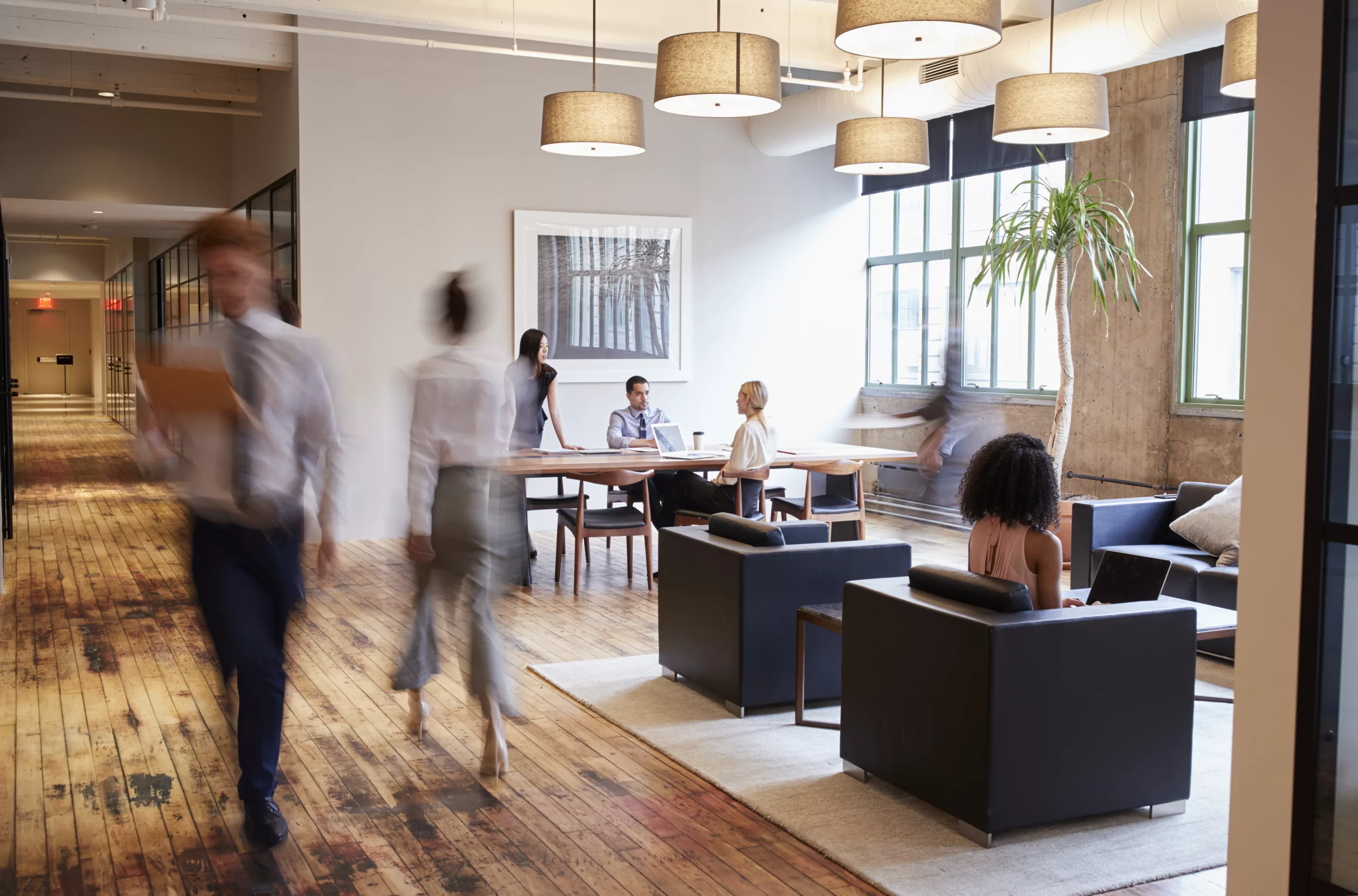 Business People At Work In A Busy Luxury Office Space