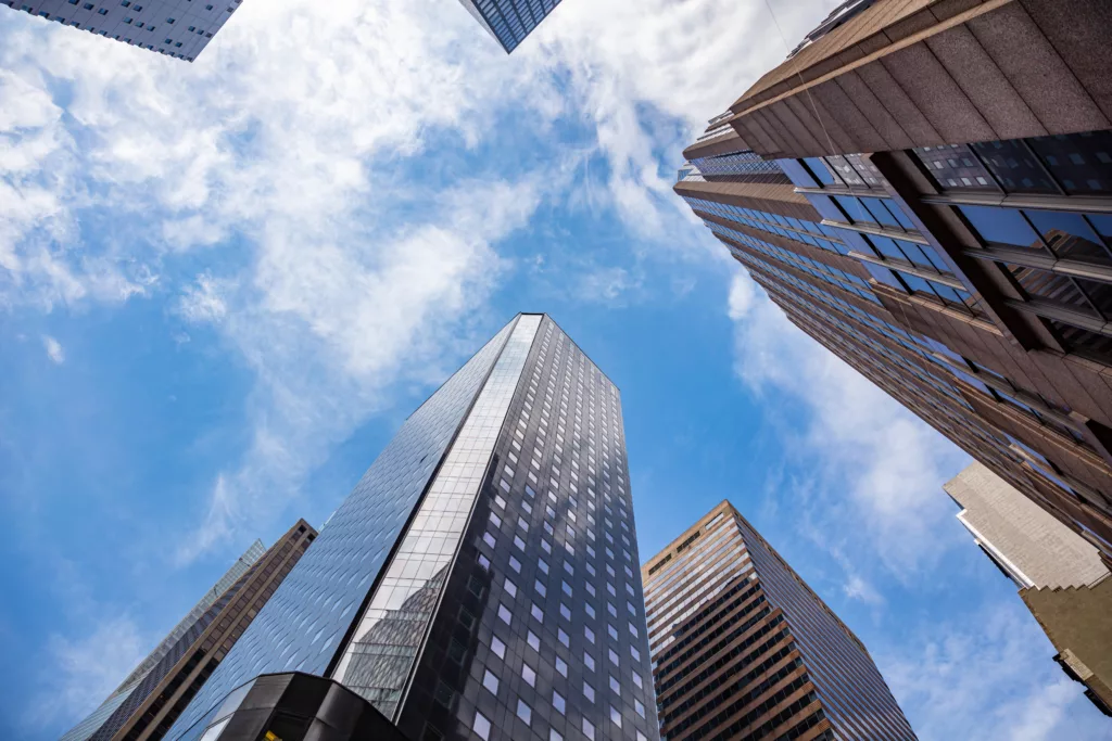 New York, Manhattan. High Buildings View From Below Against Blue